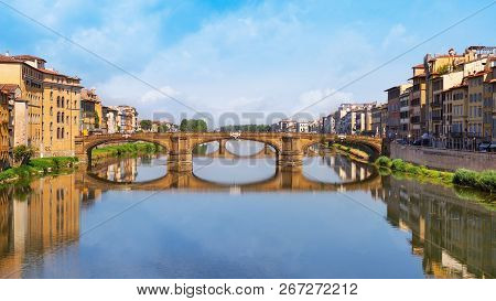 Famous Landmark Of Florence Is The Bridge Trinity. Stone Bridge Spanning The River Arno. The Oldest 