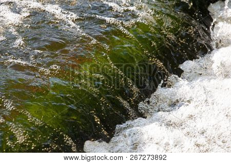 Waterfalls In Summer. Clear And Fresh Water Are Falling Down. Tints Of Green, Blue And White. There 