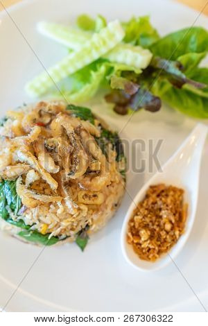egg fried rice with fried Gourami with organic vegetable.