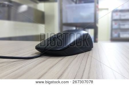 Black Mouse On Table.blur-ed Background. Quality Image.