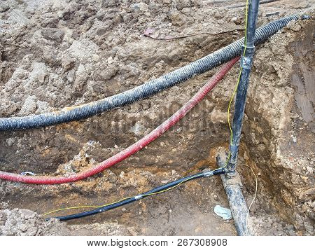 Crossection Of Metallic And Fiber Optic Cables With Potable Water Tap Threads.  Mechanized Excavatio