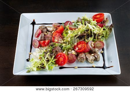 Chicken Hearts, Vegetable Salad. The Plate Occupies The Entire Frame.