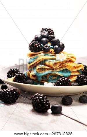 Delicious Tasty Homemade Crepes Or Pancakes With Blackberries,blueberries And Blue Spirulina Nicecre