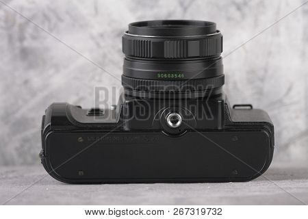 Moscow, Russia, May 14, 2017. The Old Soviet 35 Mm Slr Camera Zenit 122, Released 1997, On Cement Ba