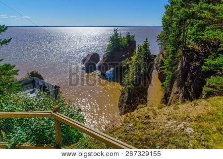 Hopewell Cape, Canada - September 24, 2018: View Of Hopewell Rocks At High Tide, With Visitors. New 