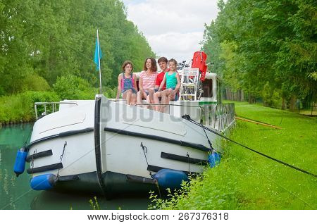 Family Vacation, Summer Holiday Travel On Barge Boat In Canal, Happy Kids And Parents Having Fun On 