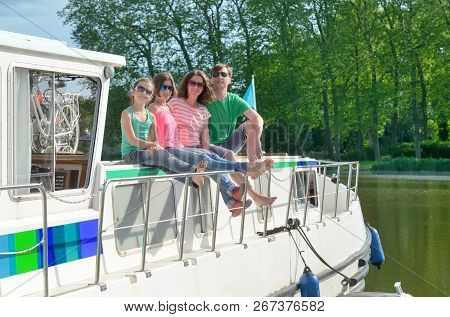Family Vacation, Summer Holiday Travel On Barge Boat In Canal, Happy Kids And Parents Having Fun On 
