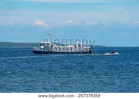 Island Anzersky, Russia - June 26, 2018: Tourists Land On The Island Of Anzersky From The Ship On An
