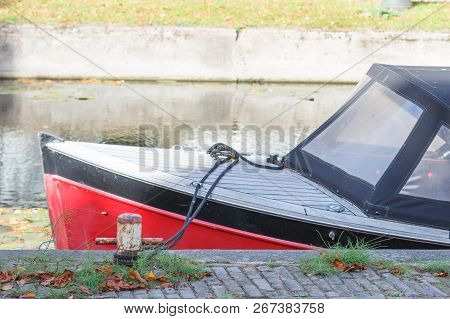 Small Motor Boat At The Pier At Channel. Side View.