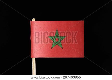 A Original And Official Flag Of Morocco On Toothpick On Black Background. Consists Of A Red Field Wi