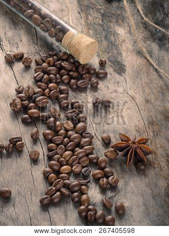 Coffee With Glass Flask And Clove On Grunge Wooden Background. Top View