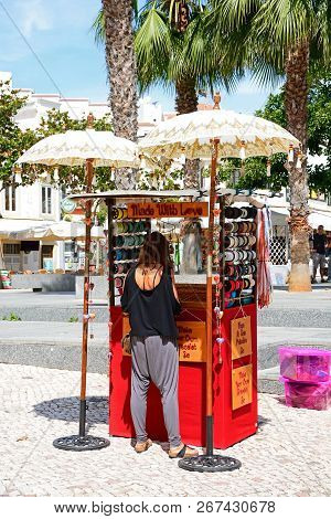 Albufeira, Portugal - June 10, 2017 - Market Stall Selling Personalised Bracelets In The Main Square