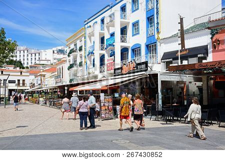 Albufeira, Portugal - June 10, 2017 - Pavement Cafes In The Main Square In The Old Town With Tourist