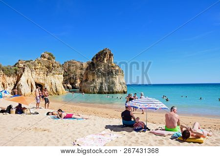 Portimao, Portugal - June 10, 2017 - Tourists Relaxing On The Beach And In The Sea, Praia Da Rocha, 