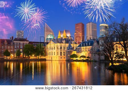 Mauritshuis Illuminated And Reflecting In Pond At Night With Fireworks, Netherlands