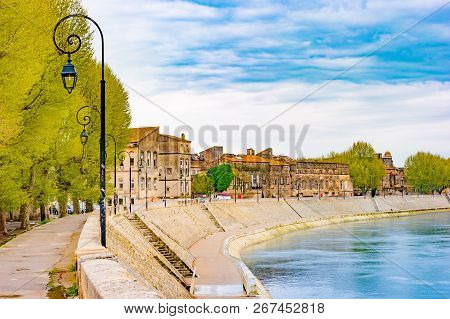 The River Rhone At Arles Overlooking The Old Town. Buches Du Rhone