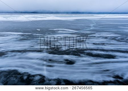 Lake Khubsugul Is Covered With Ice And Snow, Strong Cold, Thick Clear Blue Ice. Lake Khubsugul Is A 