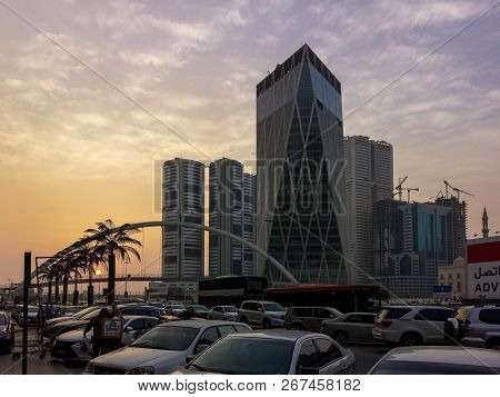 Sharjah, Uae - October 28, 2018: Sharjah City Towers, Bridge, Street At Sunset