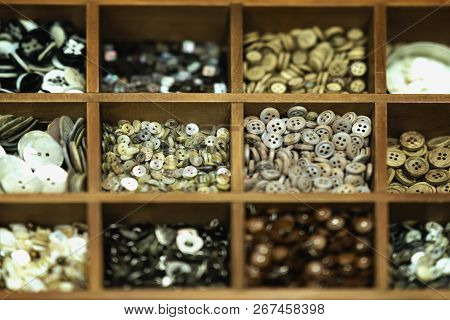 Diffrent Multicolored Buttons In Wooden Boxes For Creativity, A Real Store Shelf, Selective Backgrou