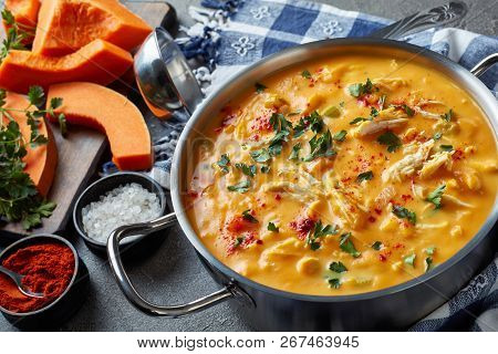 Hearty Pumpkin Carrot Chicken Breast Creamy Soup In A Metal Casserole On A Concrete Table With Kitch