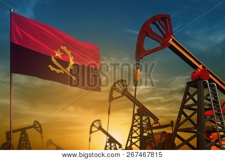 Angola Oil Industry Concept, Industrial Illustration. Fluttering Angola Flag And Oil Wells On The Bl