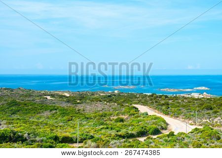 a view of La Tonnara place, on the Southern coast of Corsica, France, with the calm Mediterranean sea in the background