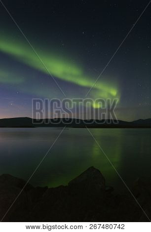 Landscape With Aurora Borealis And Tornetrask Lake. Northern Sweden