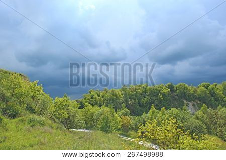 Landscape With Thundercloud Over Green Forest. Stormcloud Above Green Vegetation