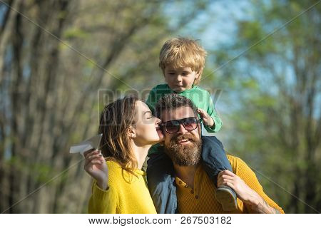 Family Trust Concept. Parents And Baby Son Enjoy Sunny Day In Park, Family Trust. Blood Is Thicker T