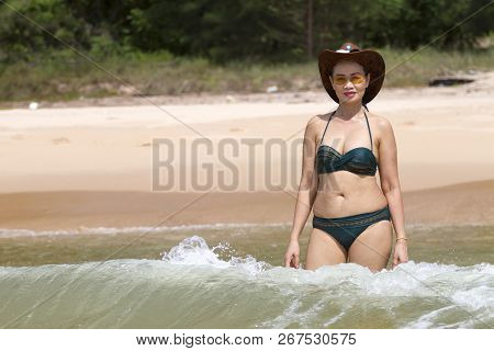 Woman Sexy Enjoy With Bikini Hat And Wave On Beach At Bang Beot Beach, Chumphon Province Thailand
