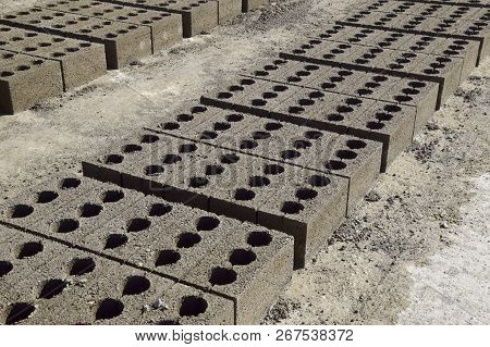 Cinder Blocks Lie On The Ground And Dried. On Cinder Block Production Plant