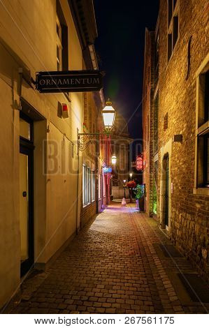 Narrow Medieval Alley In The Old Town Of Aachen, Germany, At Night
