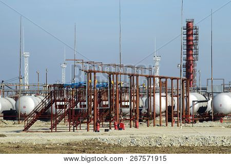 Overpass Loading Of Oil Products And Fuel Storage Vessels. The Equipment At The Refinery.