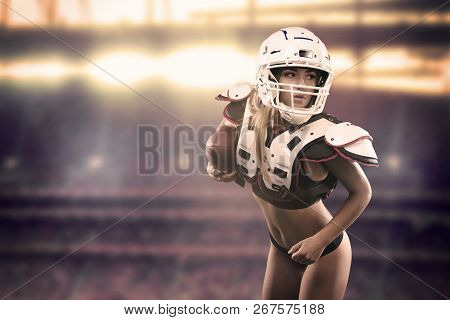 American Football Woman Player Holding Ball On The Stadium Panorama View