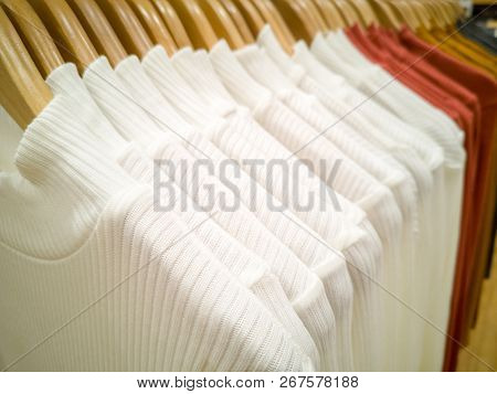 Multi-colored T-shirt Hanging In The Lining Of The Shopping Mall.