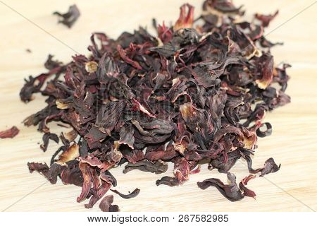 Dry Carcade Sudanese Rose On Wooden Desk