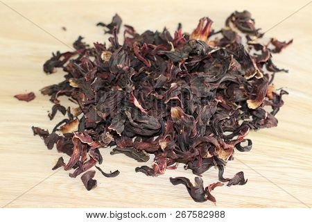 Dry Carcade Sudanese Rose On Wooden Desk