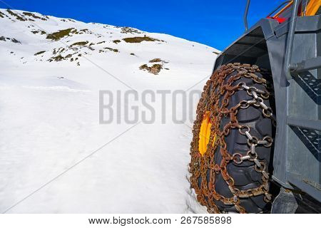 Snow clearing excavator in Aran Valley of Pyrenees in Spain