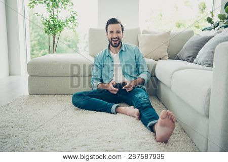 Full Legs Body Size Style Stylish Trendy Un-shaven Bearded Man Sit Near Comfort Sofa On The Comfort 