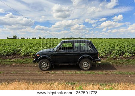 Dnipropetrovsk Region, Ukraine - July 08, 2017: Vaz Niva Blue-green Color On The Dirt Road Near The 