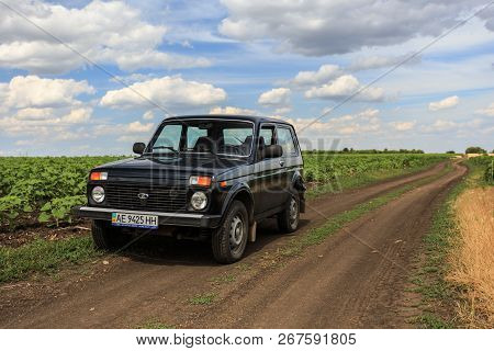 Dnipropetrovsk Region, Ukraine - July 08, 2017: Vaz Niva Blue-green Color On The Dirt Road Near The 
