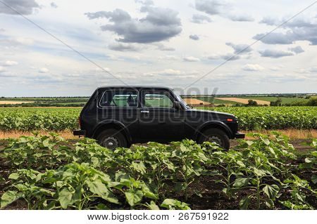Dnipropetrovsk Region, Ukraine - July 08, 2017: Vaz Niva Blue-green Color On The Dirt Road Near The 
