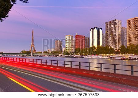 Paris Cityscape With Eiffel Tower, Quay De Grenelle And Seine River At Sunset, Paris, France.