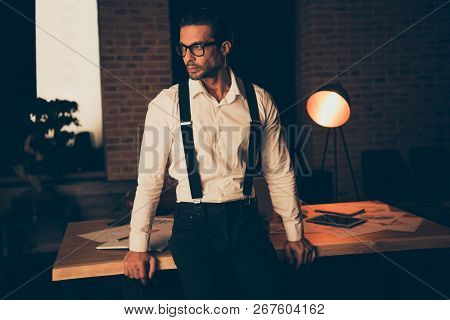 Attractive Un-shaven Man In Classic Shirt Suspender Stand Inside Loft Industrial Interior In Eyeglas