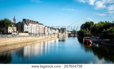 Buildings Are Reflected On The Sarthe River In The City Of Le Mans In Western France. Le Mans Is An 
