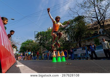 Kolkata, West Bengal, India - March 1st 2015 : Boy Jumps Off Barriers While Rollerskating On Park St