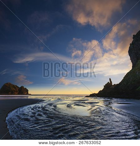 Last Light At Piha Beach, On Aucklands West Coast, One Of New Zealands Most Famous And Most Beautifu