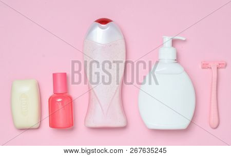 Products For The Care Of Body, Hair And Personal Hygiene On A Multi-colored Paper Background. A Bott