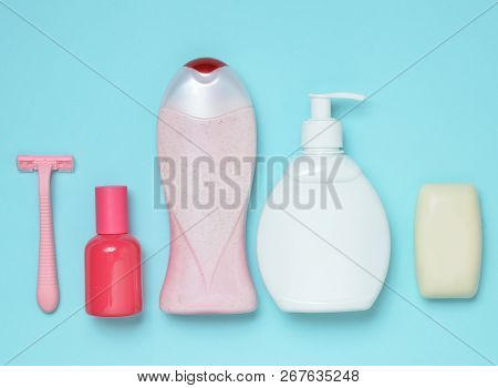 Products For The Care Of Body, Hair And Personal Hygiene On A Blue Pastel Background. A Bottle Of Fr