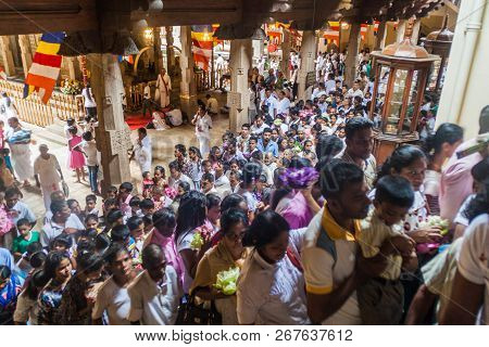 Kandy, Sri Lanka - July 19, 2016: White Clothed Buddhist Devotees In The Temple Of Sacred Tooth Reli